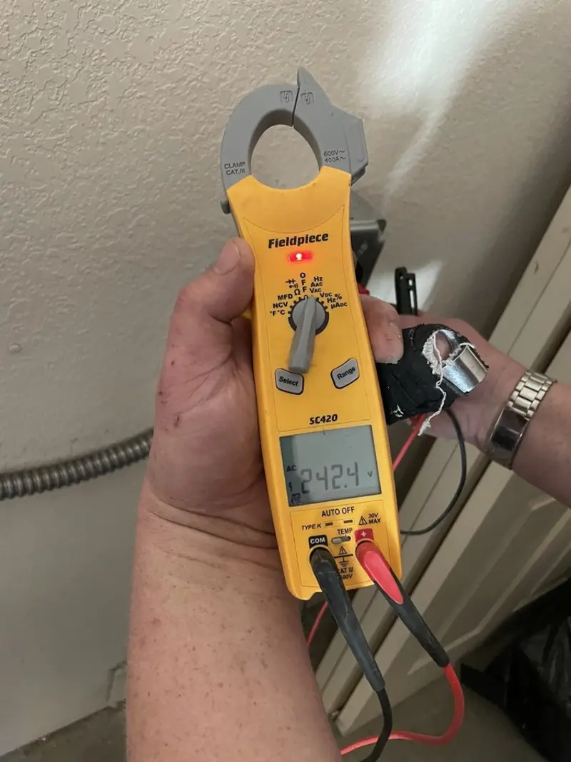 Voltage testing with clamp meter during Electrical Installation Services in Council Bluffs